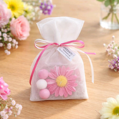 Μπομπονιέρα κερί λουλούδι μαργαρίτα σε πουγκί